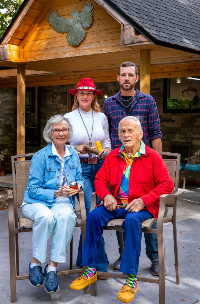 Emily Dicob and her husband sitting outside the Sterling Roots studio with the Stonehouse Silversmiths, continuing three generations of family silversmithing.