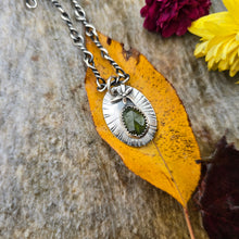Load image into Gallery viewer, Hand-forged sterling silver dragonfly pendant with peridot gemstone, crafted in the Sterling Roots studio.