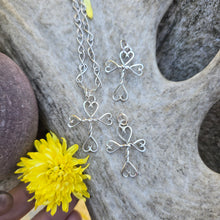 Load image into Gallery viewer, Tiny hand-forged sterling silver cross pendant with twisted wire and heart-shaped ends — Sterling Roots Jewelry.