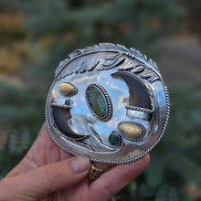 Load image into Gallery viewer, sterling silver belt buckle with turquoise centerpiece, elk ivory accents, and bear claw design side view