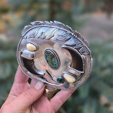 Load image into Gallery viewer, sterling silver belt buckle with turquoise centerpiece, elk ivory, feather accents, and bear claw design top view