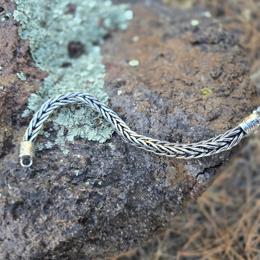 Fourteen gauge sterling silver foxtail chain bracelet, handwoven piece by piece with a substantial, structured form.
