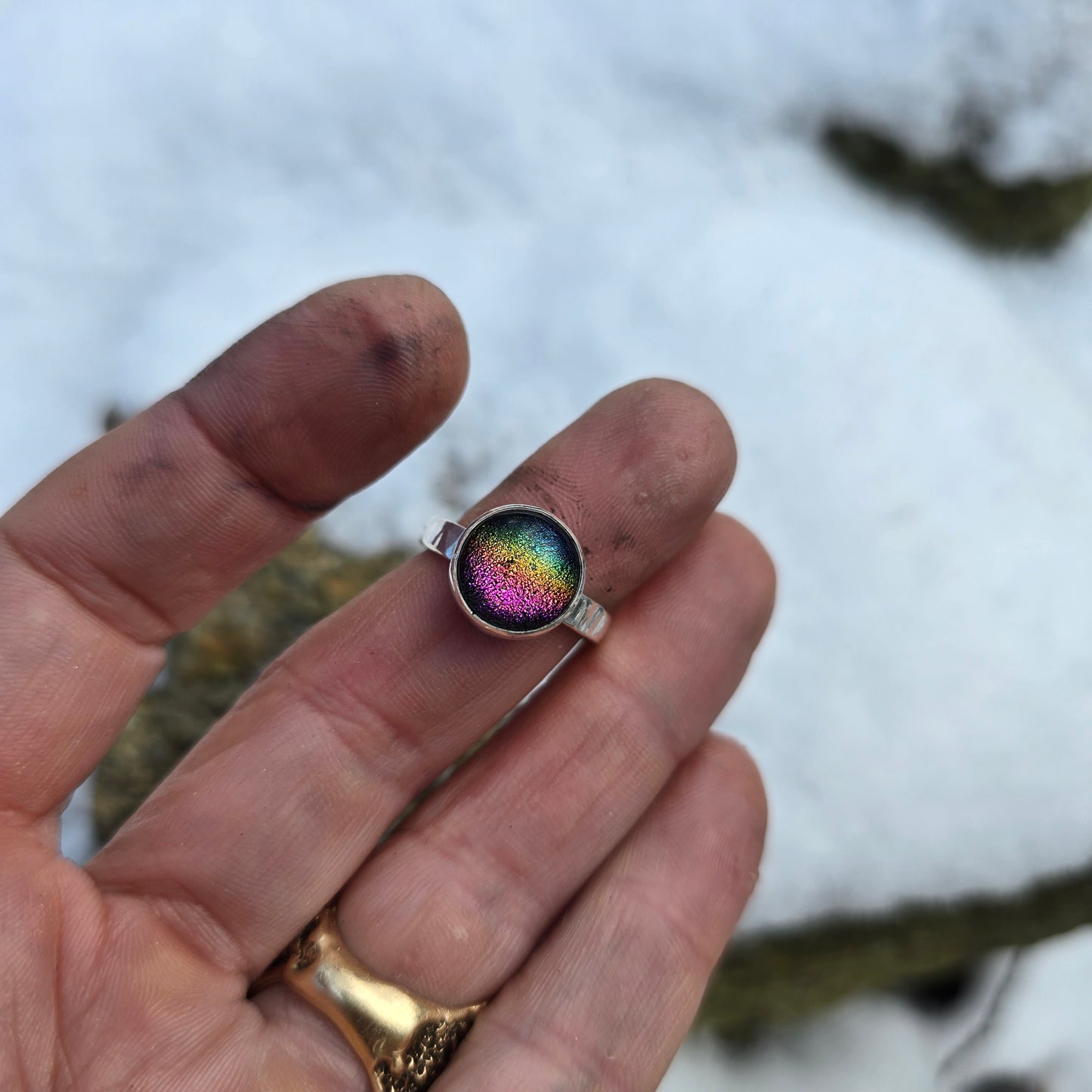 rainbow dichroic glass ring with custom name band worn on hand top view