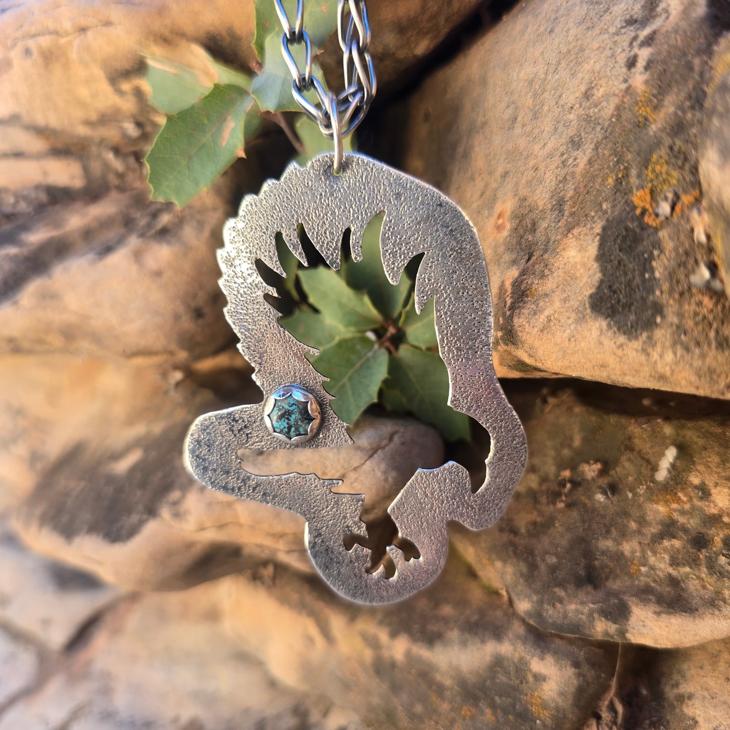 Bird landing silhouette oxidized sterling silver pendant with turquoise accent textured surface and large bail for thick chain