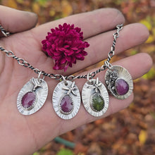Load and play video in Gallery viewer, Small pendant collection forged in sterling silver, featuring ruby and peridot gemstones paired with organic nature motifs — artisan jewelry by Sterling Roots.