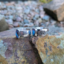 Load image into Gallery viewer, angled view of pair of purple Mohave turquoise rings showing stone color and band details