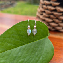 Load image into Gallery viewer, Hand-forged rainbow moonstone threader earrings, approximately 1 inch, showing luminous color and minimal design.