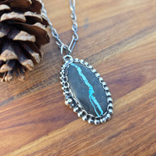 Load image into Gallery viewer, Sterling and Royston Ribbon turquoise pendant on chain angled view