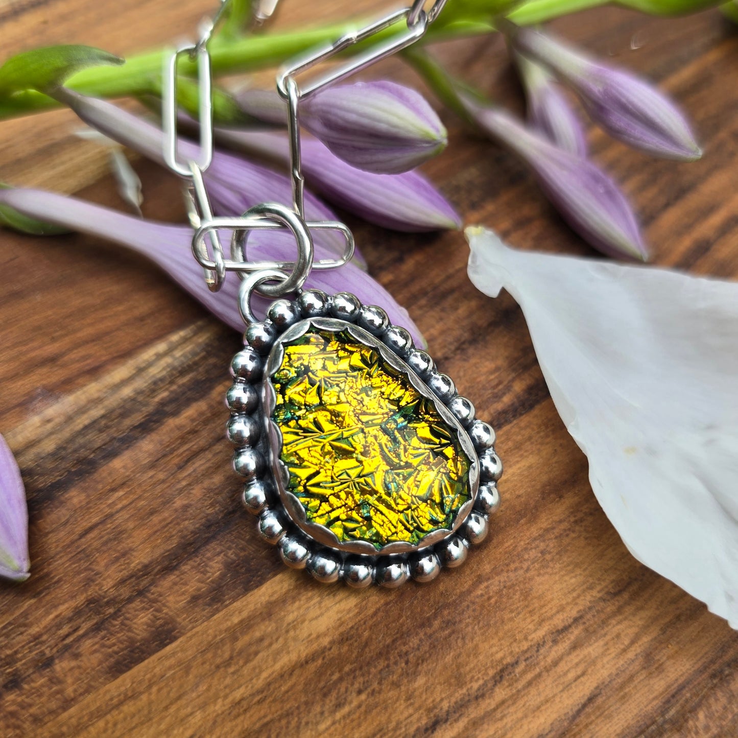 Oxidized sterling silver and yellow dichroic glass pendant