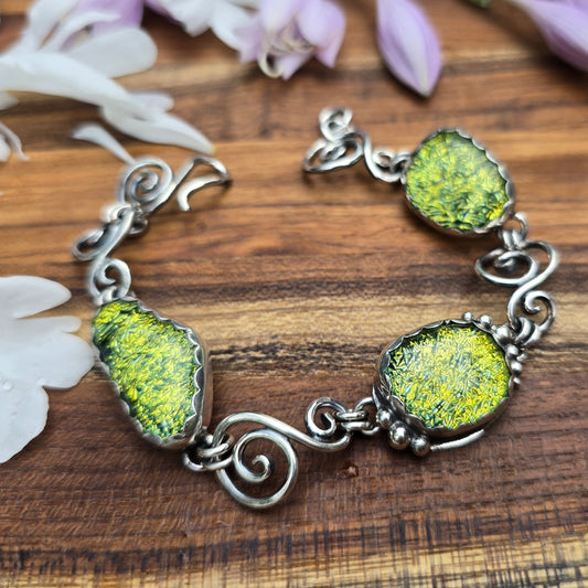 Sterling silver swirl and yellow dichroic bracelet top view