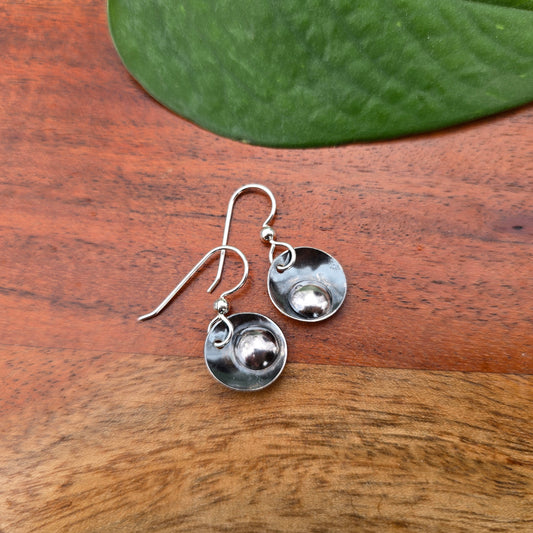 pair of sterling silver earrings each featuring a single drop element