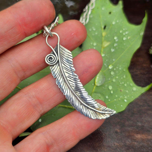 Hand-Forged Sterling Silver Feather Pendant with 18 Karat Gold Dust