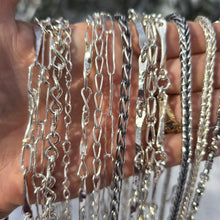 Load image into Gallery viewer, collection of sterling silver shiny and oxidized chains shown on hand front view