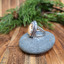 Load image into Gallery viewer, side profile of sterling silver ring with elk ivory and carved feather wrap