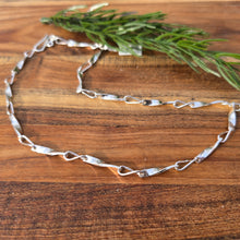 Load image into Gallery viewer, sterling silver shiny quarter twist short chain detailed view from front