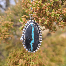 Load image into Gallery viewer, Sterling and Royston Ribbon turquoise pendant displayed on natural tree background
