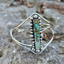Load image into Gallery viewer, Rectangular turquoise set in hand-forged sterling silver cuff angled view