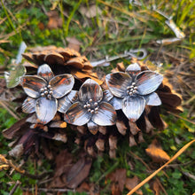 Load image into Gallery viewer, Sterling silver trillium statement necklace on pinecones