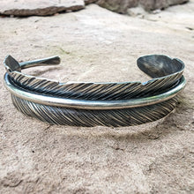 Load image into Gallery viewer, close up view of feather cuff made from sterling silver by Emily Dicob