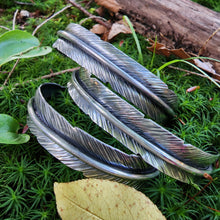 Load image into Gallery viewer, side angle of sterling silver feather cuff bracelets in moss