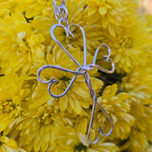 Load image into Gallery viewer, Detailed view of handmade sterling silver cross with hearts by Sterling Roots
