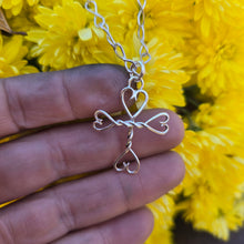 Load image into Gallery viewer, Adirondack-made sterling silver cross with hearts — small scale, heirloom quality.
