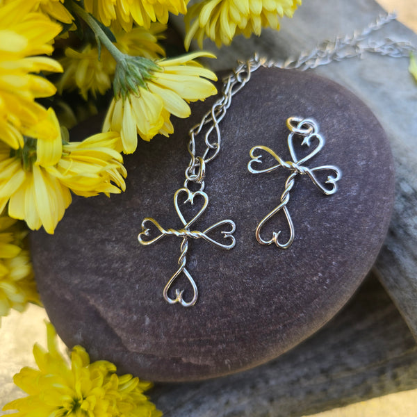 handcrafted sterling silver cross with hearts pendant by Sterling Roots.