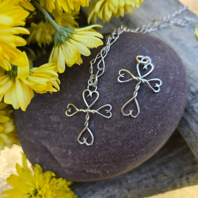 handcrafted sterling silver cross with hearts pendant by Sterling Roots.
