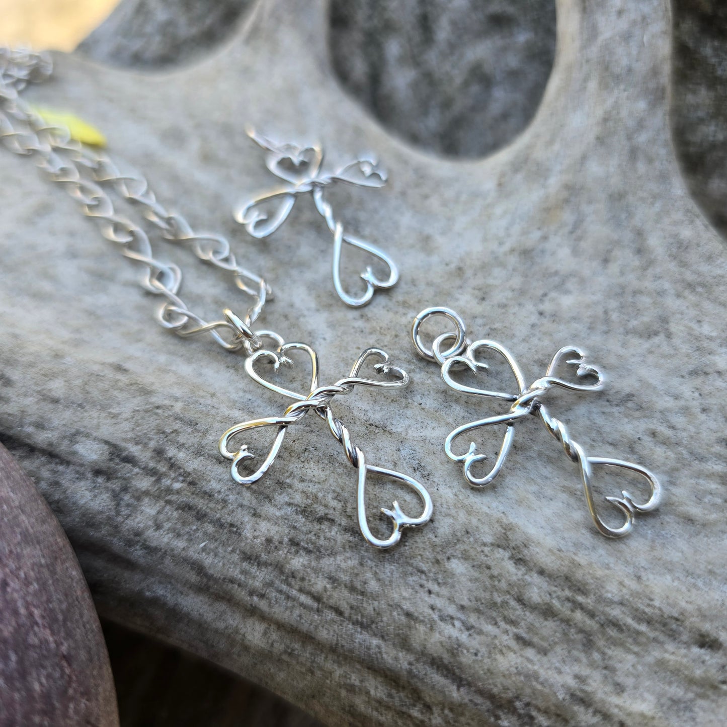 Mini silver cross pendant handcrafted in the Adirondacks using traditional silversmithing techniques.