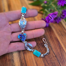 Load image into Gallery viewer, Close-up of handcrafted turquoise and sterling silver bracelet, forged by Northern New York silversmith Emily Dicob of Sterling Roots.
