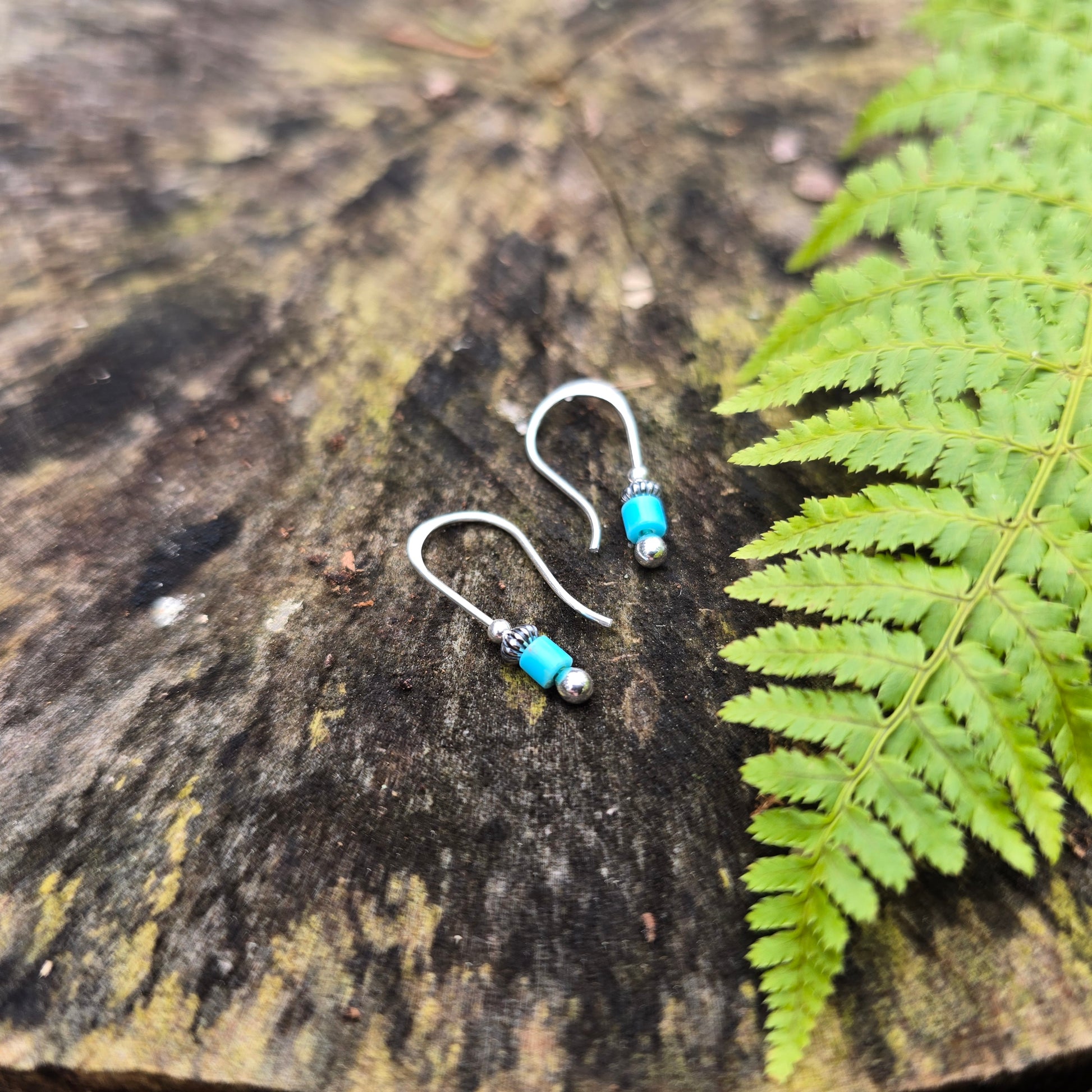 Hand-forged sterling silver threader earrings with turquoise, crafted in Northern New York by silversmith Emily Dicob.