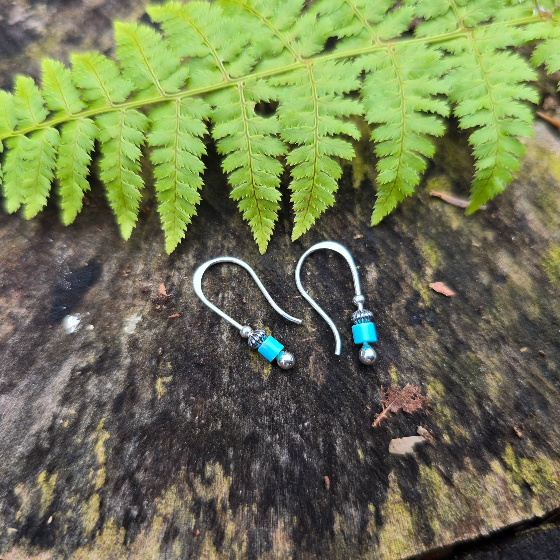 Adirondack silversmith Emily Dicob’s hand-forged turquoise and sterling silver threader earrings.