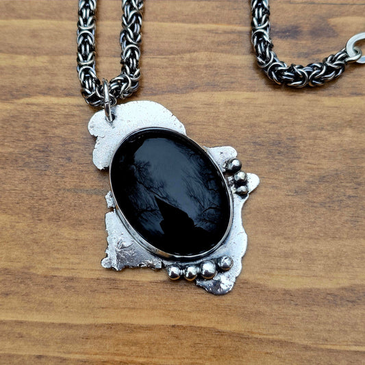 large black onyx pendant paired with sterling silver byzantine chain