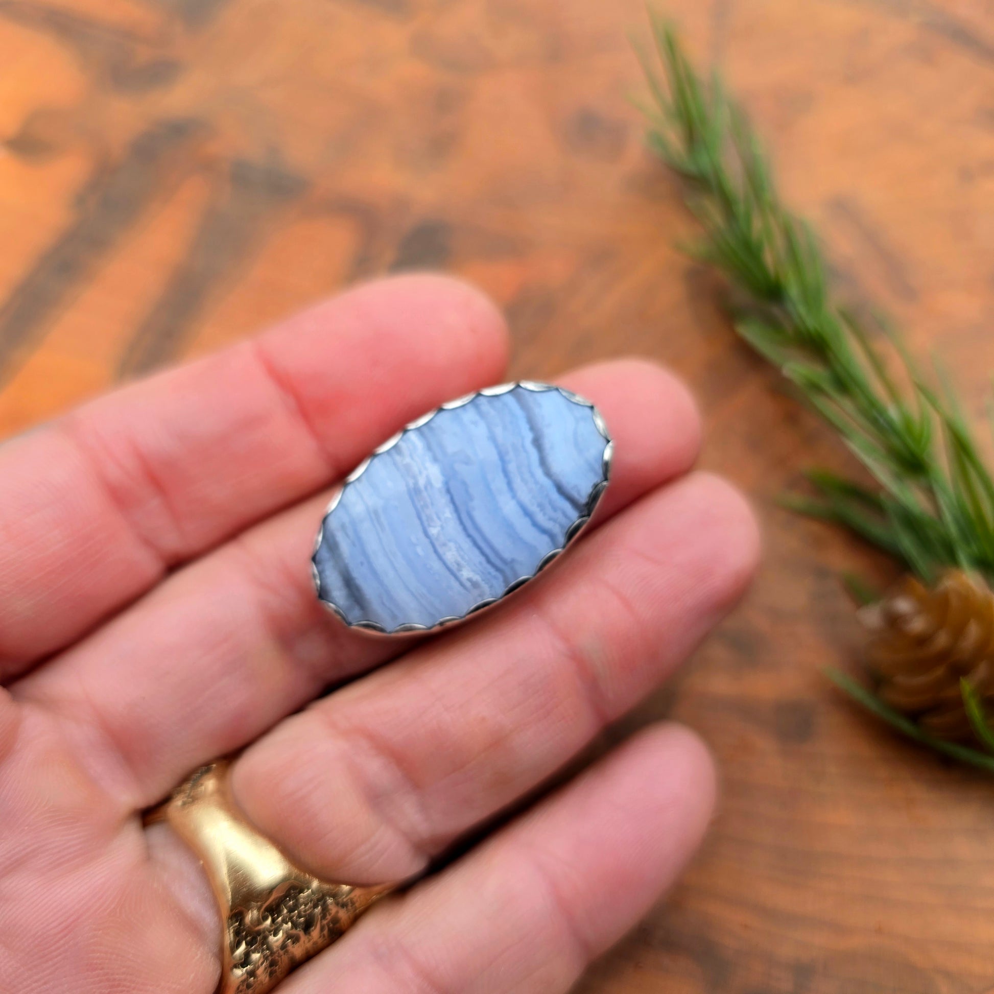 Crazy lace agate double shank ring in sterling silver on hand
