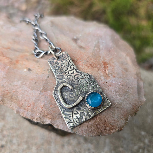 Hand-Forged Floral Cow Tag Sterling Silver Pendant with Blue Cats Eye