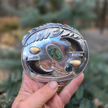 Load image into Gallery viewer, sterling silver belt buckle with turquoise centerpiece, elk ivory, feather accents, and bear claw design
