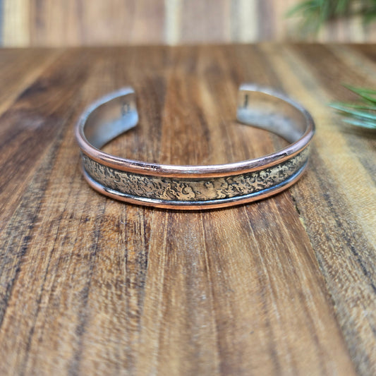 domed sterling silver bracelet with copper sides