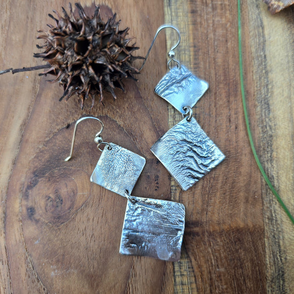 reticulated silver earrings top view