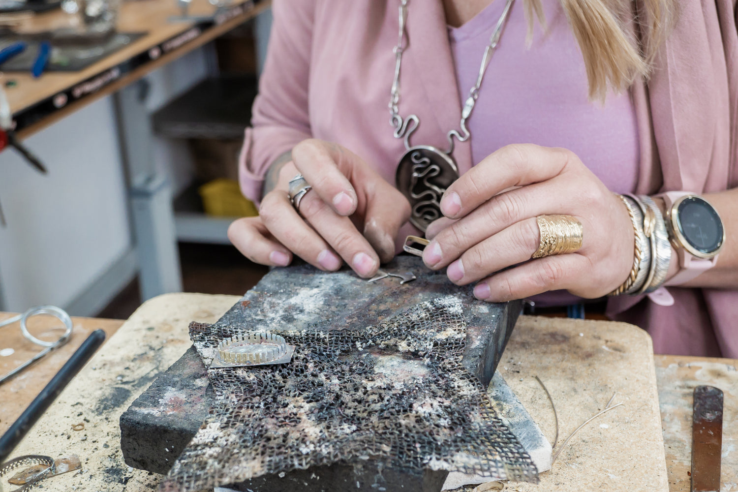 Emily Dicob, third-generation traditional silversmith, forging nature-inspired jewelry by hand in adirondack foothills studio.