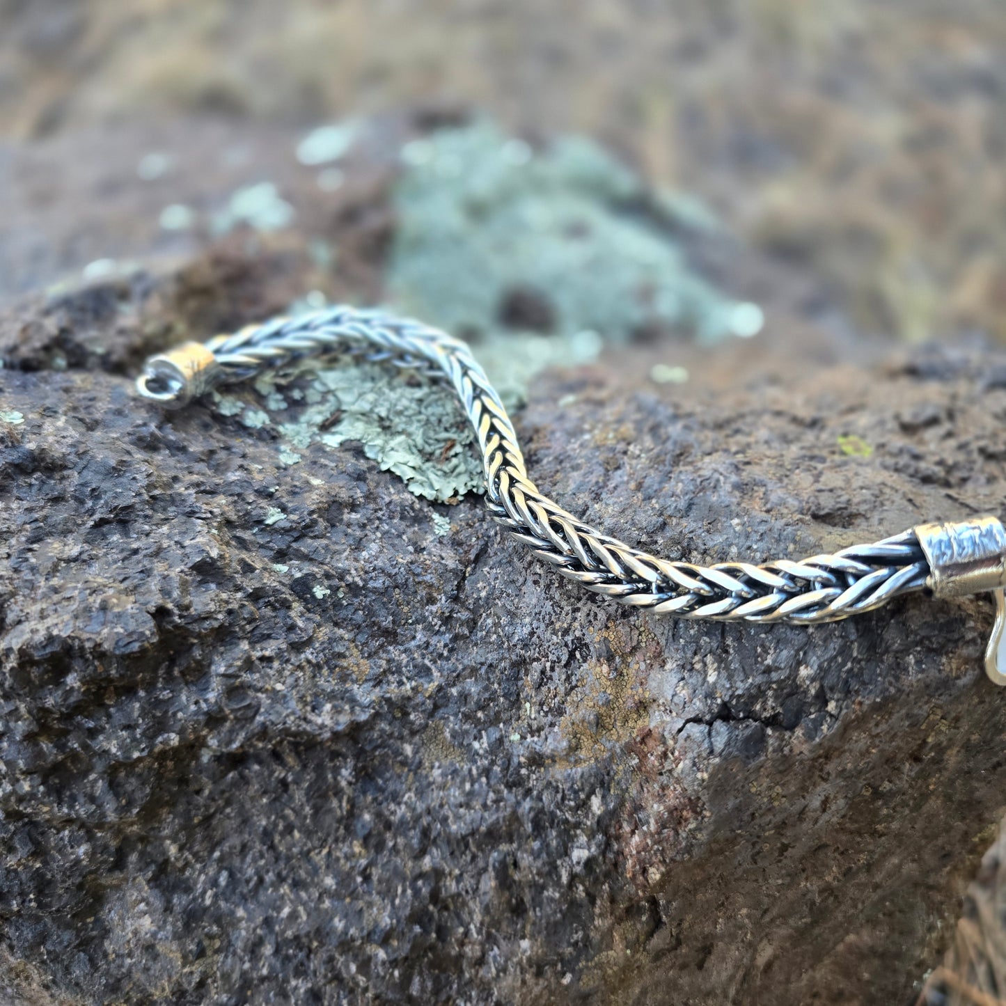 Sterling silver foxtail chain bracelet with reticulated end caps and a handmade clasp, woven and assembled by hand.