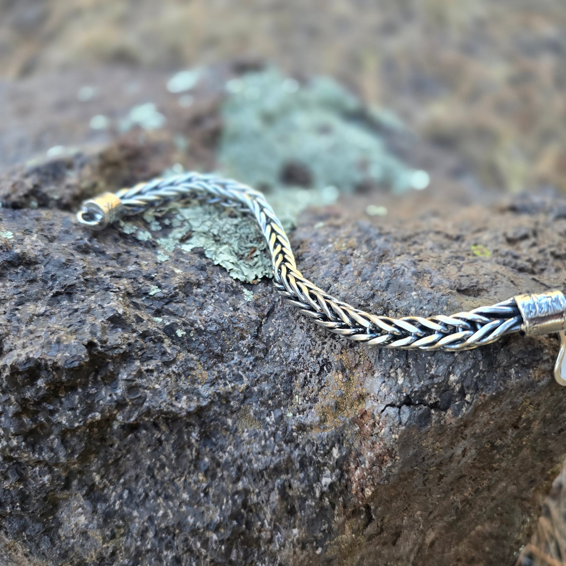Sterling silver foxtail chain bracelet with reticulated end caps and a handmade clasp, woven and assembled by hand.