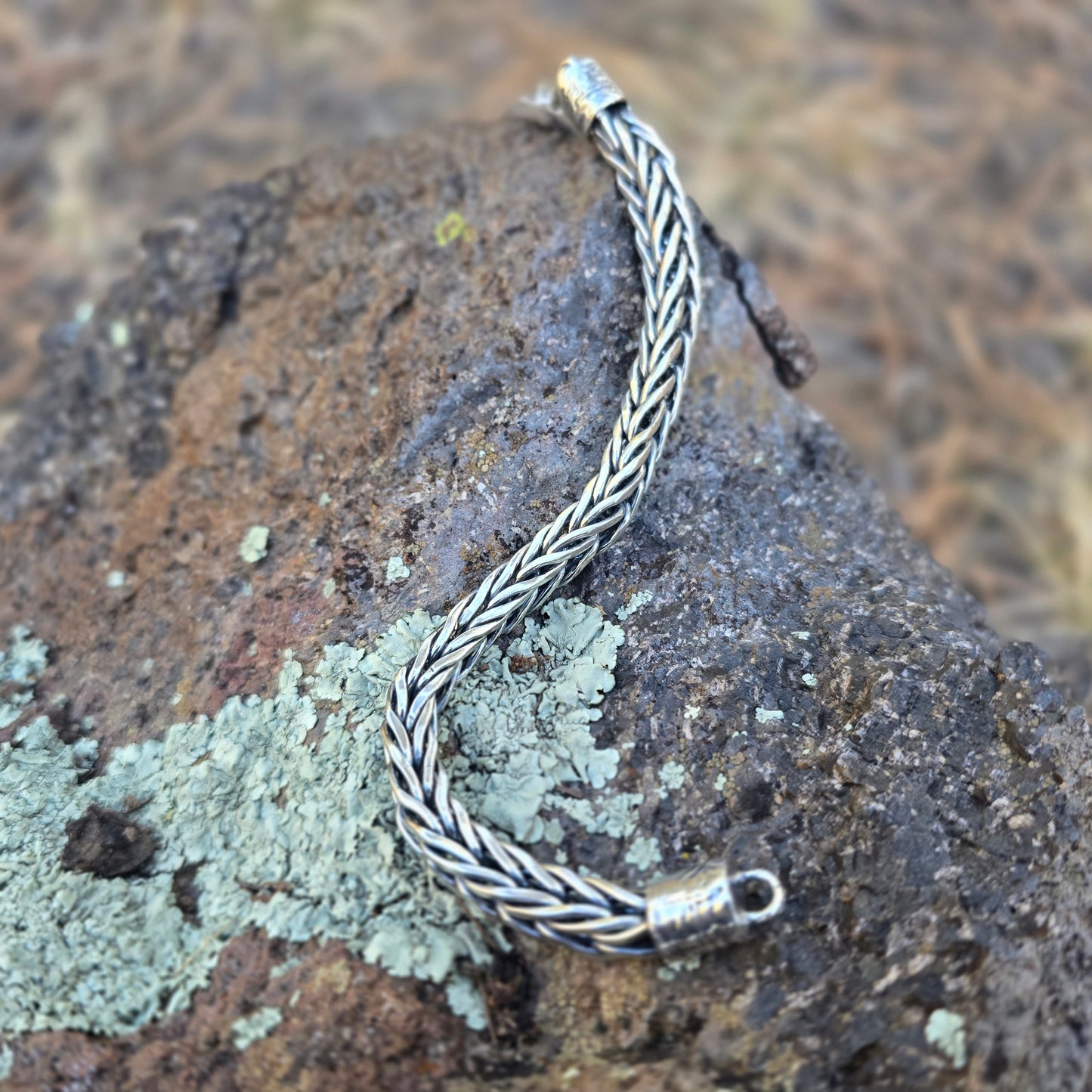 Solid sterling silver foxtail bracelet handwoven link by link, featuring a dense chain profile and hand-built clasp.