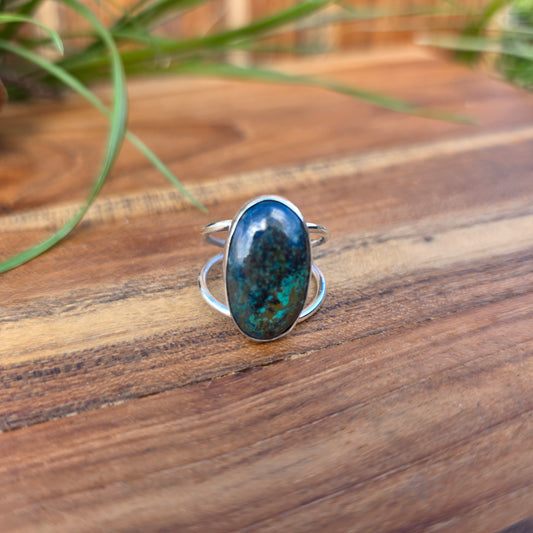 Polished azurite ring showing green and blue coloration with a split shank and minimal profile front view.