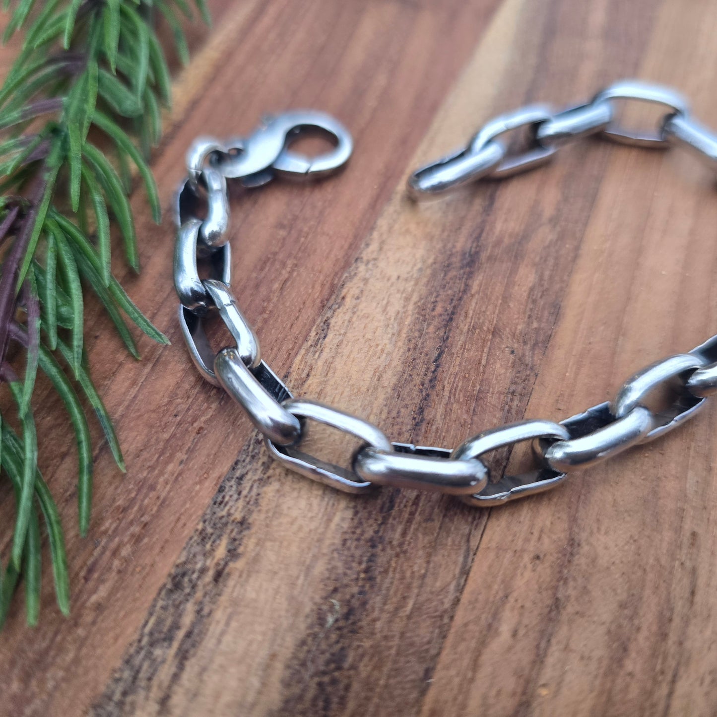 Detail of half round paperclip links in oxidized sterling silver bracelet