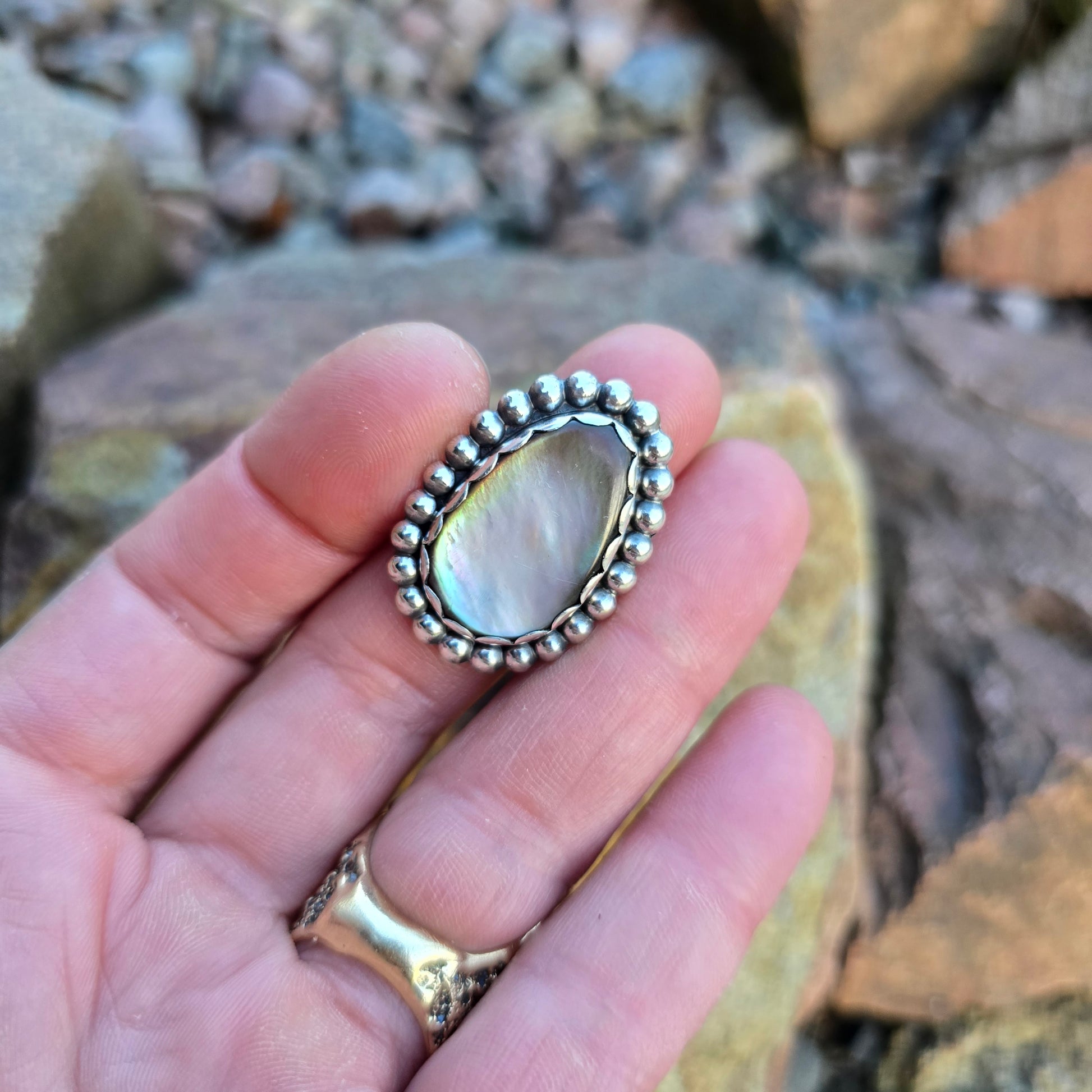 White Mother of Pearl cabochon ring in hand-forged sterling silver with beaded bezel