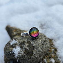 Load image into Gallery viewer, angled view of rainbow dichroic glass ring with name stamped around band
