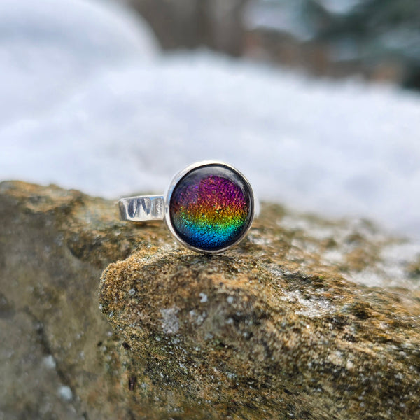 front view of custom name ring with rainbow dichroic glass stone