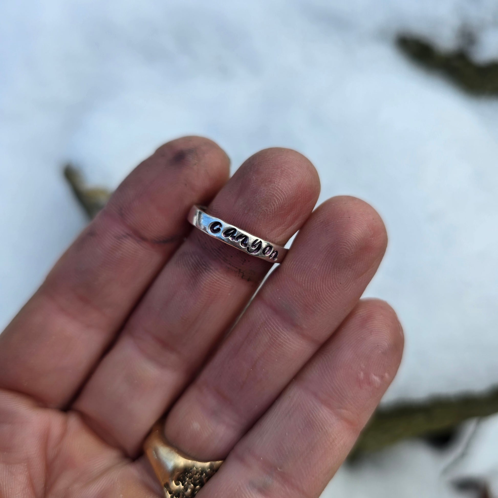 rainbow dichroic glass ring with custom name band worn on hand