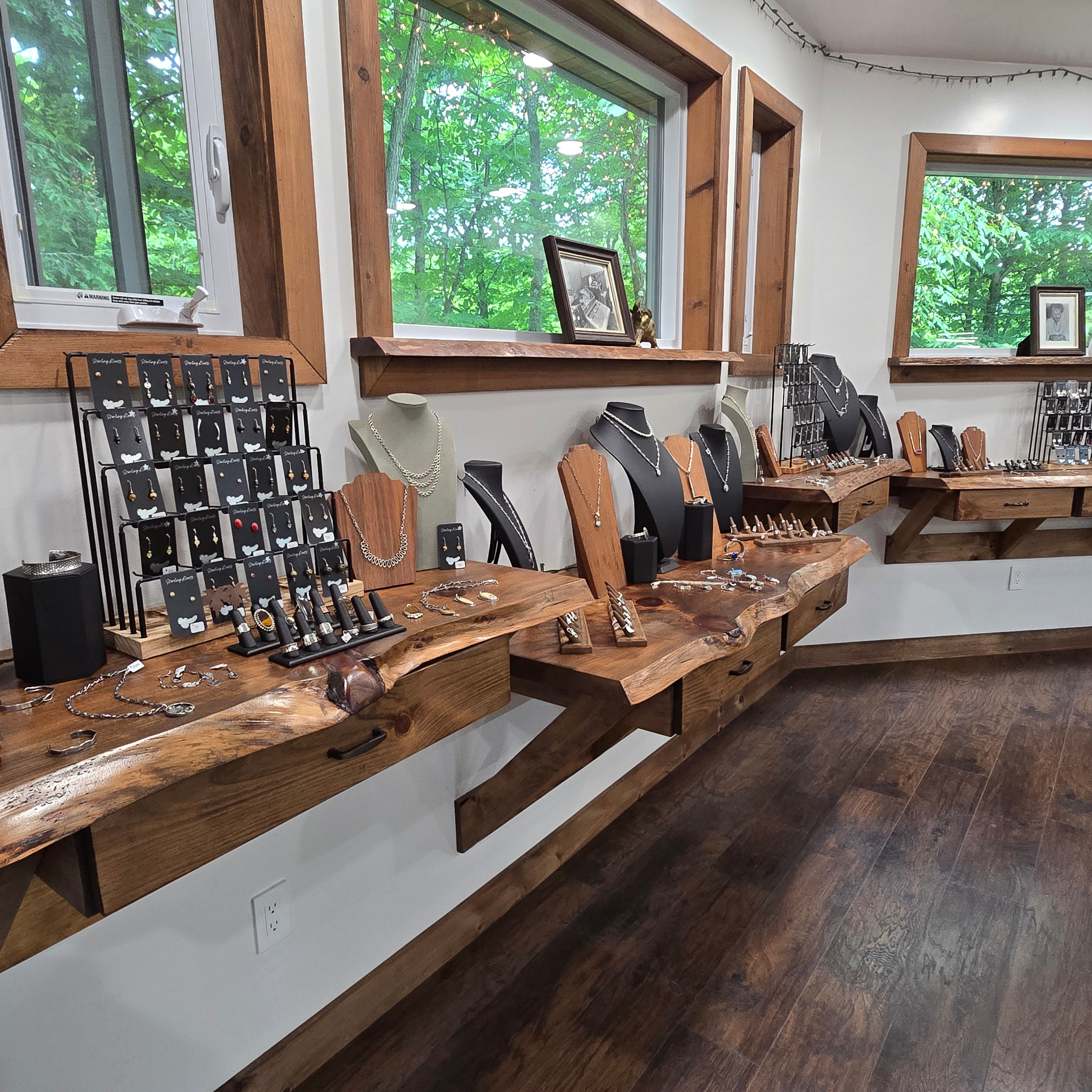Detailed view of jewelry on display inside Sterling Roots Studio in the Adirondack Foothills. 
