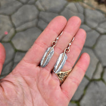 Load image into Gallery viewer, mixed-metal feather earrings with sterling silver feathers and copper stems.
